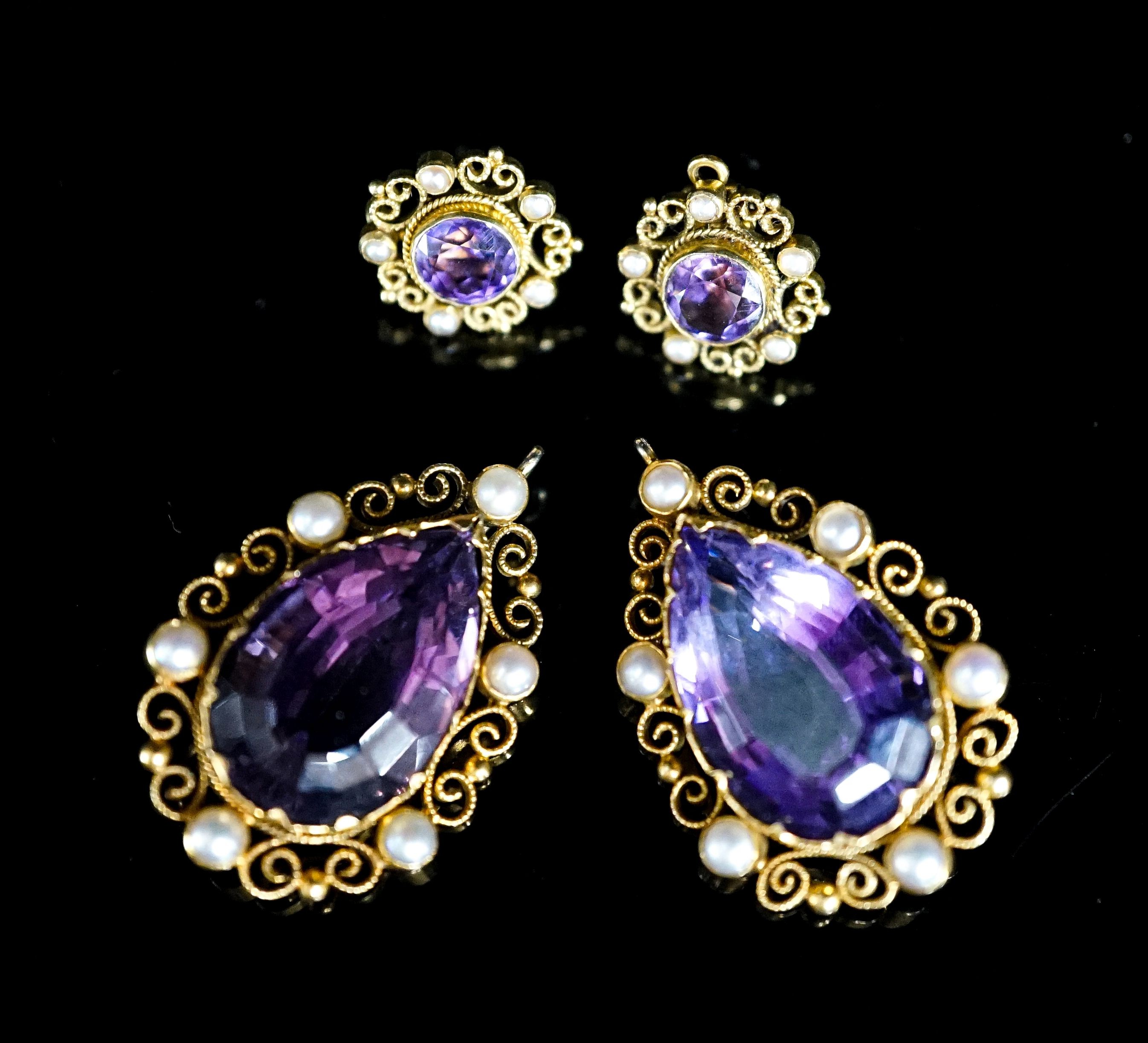 A pair of yellow metal and split pearl mounted pear cut amethyst pendants, 35mm and a pair of similar ear studs, gross weight 23.9 grams.